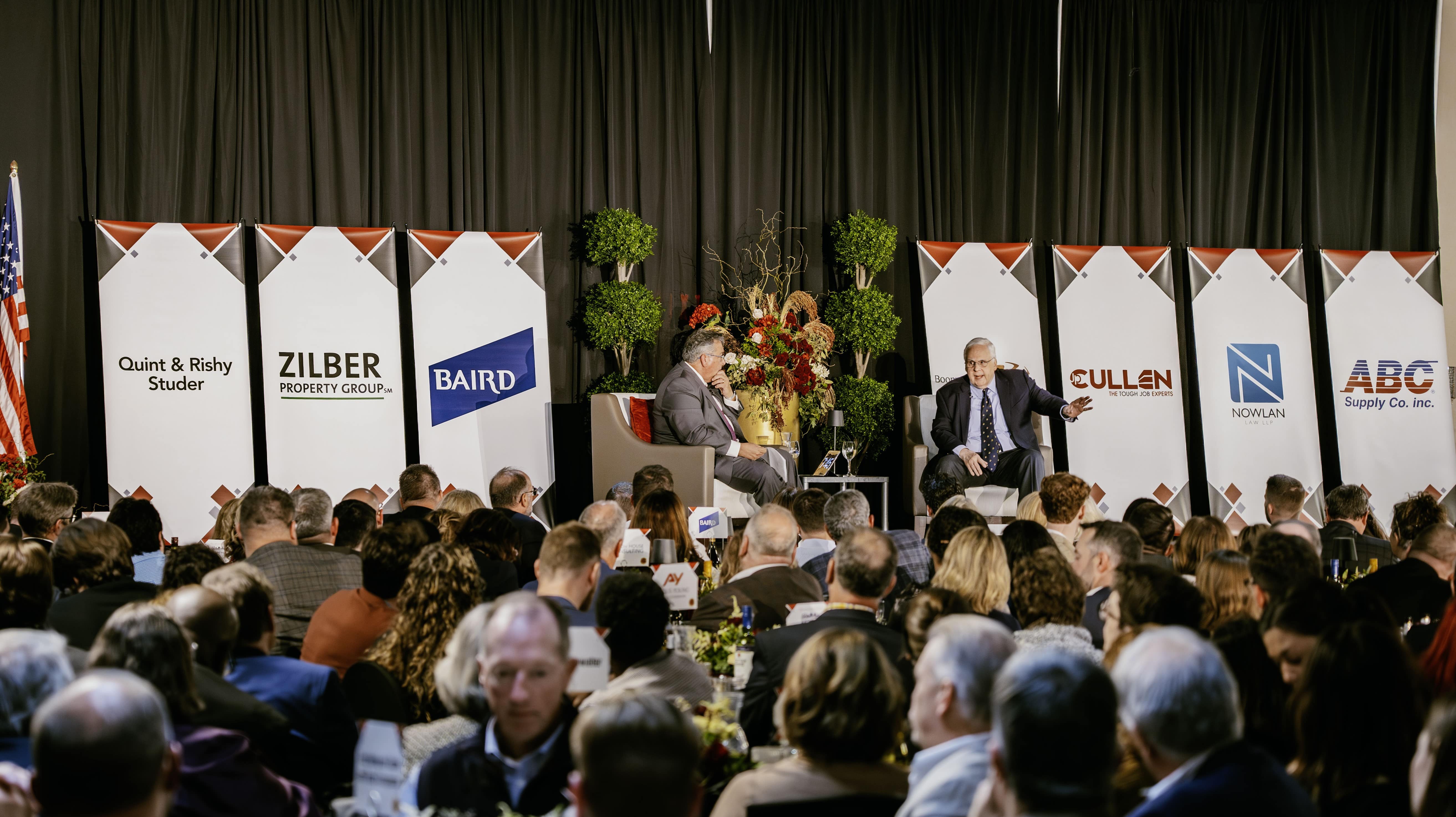 A photo of the stage and speakers at the 2024 Forward Janesville Annual Dinner.